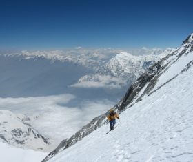 People climbing the snowy mountains Stock Photo