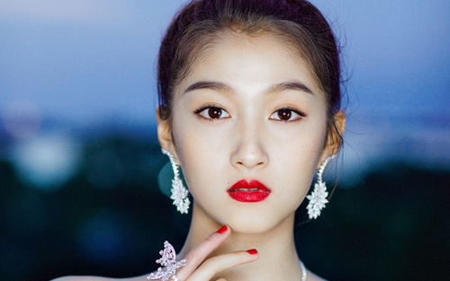 Stock Photo Asian girl wearing jewelry earrings