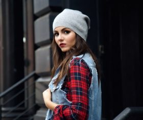 Stock Photo Girl wearing a knit cap wearing a denim jacket