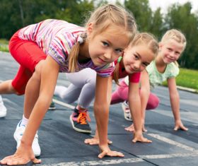 Stock Photo Little girls preparing for running competition
