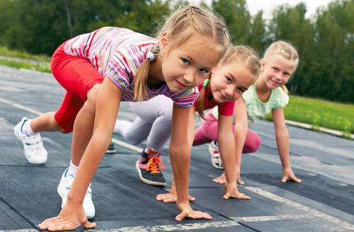 Stock Photo Little girls preparing for running competition