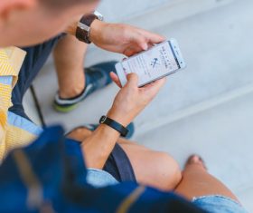 Stock Photo Man playing with mobile phone