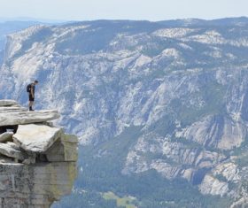Stock Photo Man standing on the cliffs