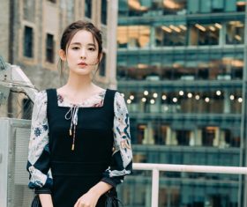 Stock Photo Pretty girl standing on the sightseeing balcony