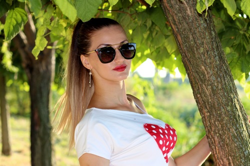Stock Photo Woman in the shade with sunglasses Stock Photo