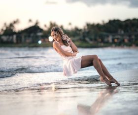 Stock Photo Woman levitation on the beach