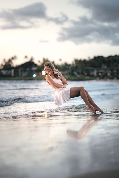 Stock Photo Woman levitation on the beach