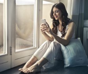Stock Photo Woman looking at cell phone 04