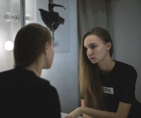 Stock Photo Woman looking in the mirror 06