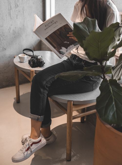 Stock Photo Woman resting and reading magazine