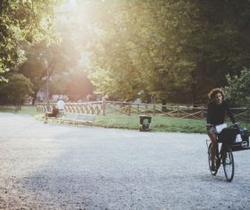 Stock Photo Woman riding a bicycle in the morning