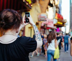 Stock Photo Woman tourist taking pictures