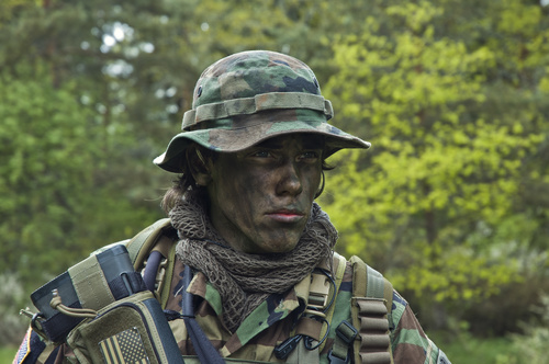 Stock Photo special soldier with oil paint on his face