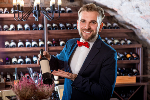 Waiter introduces wine Stock Photo