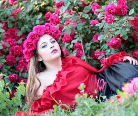 Woman with a wreath of roses on the head Stock Photo 02
