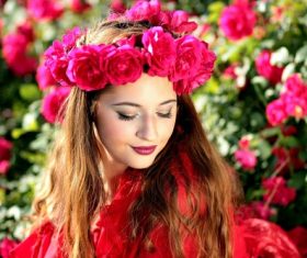 Woman with a wreath of roses on the head Stock Photo 04