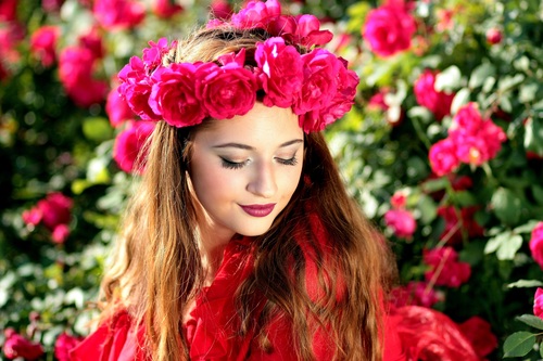 Woman with a wreath of roses on the head Stock Photo 04