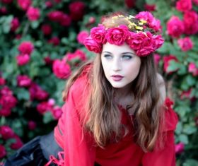 Woman with a wreath of roses on the head Stock Photo 05