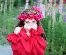 Woman with a wreath of roses on the head Stock Photo 07
