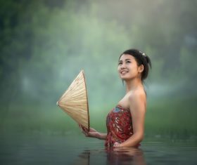 Young beautiful Cambodian girl in the water Stock Photo