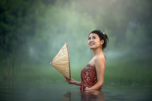 Young beautiful Cambodian girl in the water Stock Photo