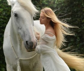 Young girl with horse Stock Photo