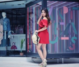 Girl posing in the commercial street Stock Photo