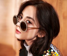 Girl wearing fashionable black sunglasses Stock Photo