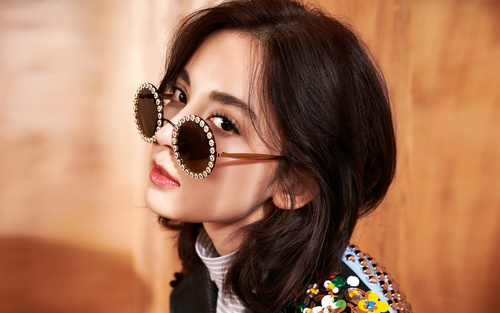 Girl wearing fashionable black sunglasses Stock Photo
