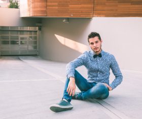 Man wearing floral shirt jeans Stock Photo
