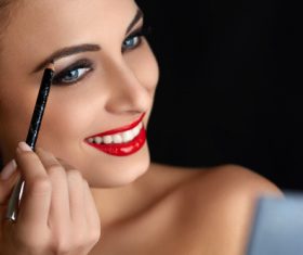 Paint the brows woman Stock Photo