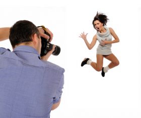 Photographer shooting jumping woman Stock Photo
