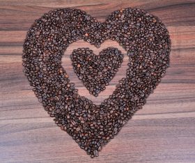 Placing coffee beans heart-shaped pattern Stock Photo