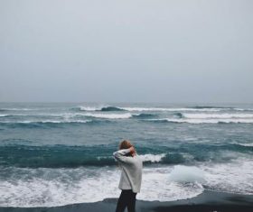 Taking pictures of people standing on the beach Stock Photo 01
