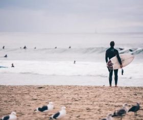 Taking pictures of people standing on the beach Stock Photo 02