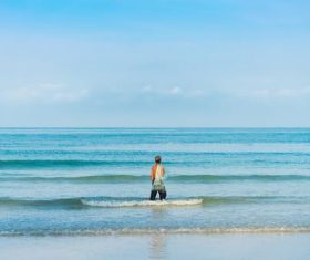 Taking pictures of people standing on the beach Stock Photo 03