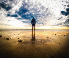 Taking pictures of people standing on the beach Stock Photo 06