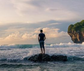 Taking pictures of people standing on the beach Stock Photo 07