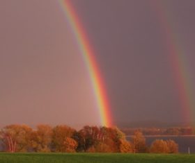 Two rainbows on the horizon Stock Photo