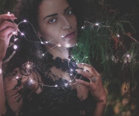 Woman and shining lamp Stock Photo 02