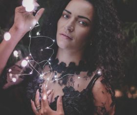 Woman and shining lamp Stock Photo 03