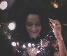 Woman and shining lamp Stock Photo 04