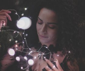 Woman and shining lamp Stock Photo 06