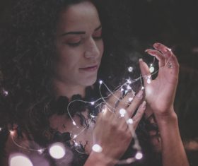 Woman and shining lamp Stock Photo 07