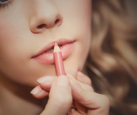 apply lipstick Stock Photo