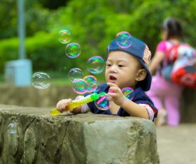 Children blowing bubbles Stock Photo 02