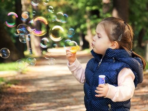 Children blowing bubbles Stock Photo 03