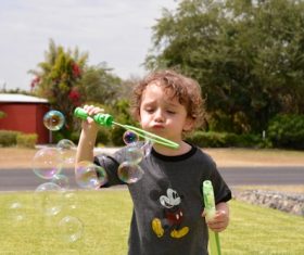 Children blowing bubbles Stock Photo 06