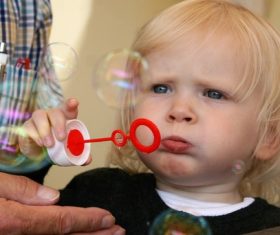 Children blowing bubbles Stock Photo 07