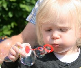 Children blowing bubbles Stock Photo 08